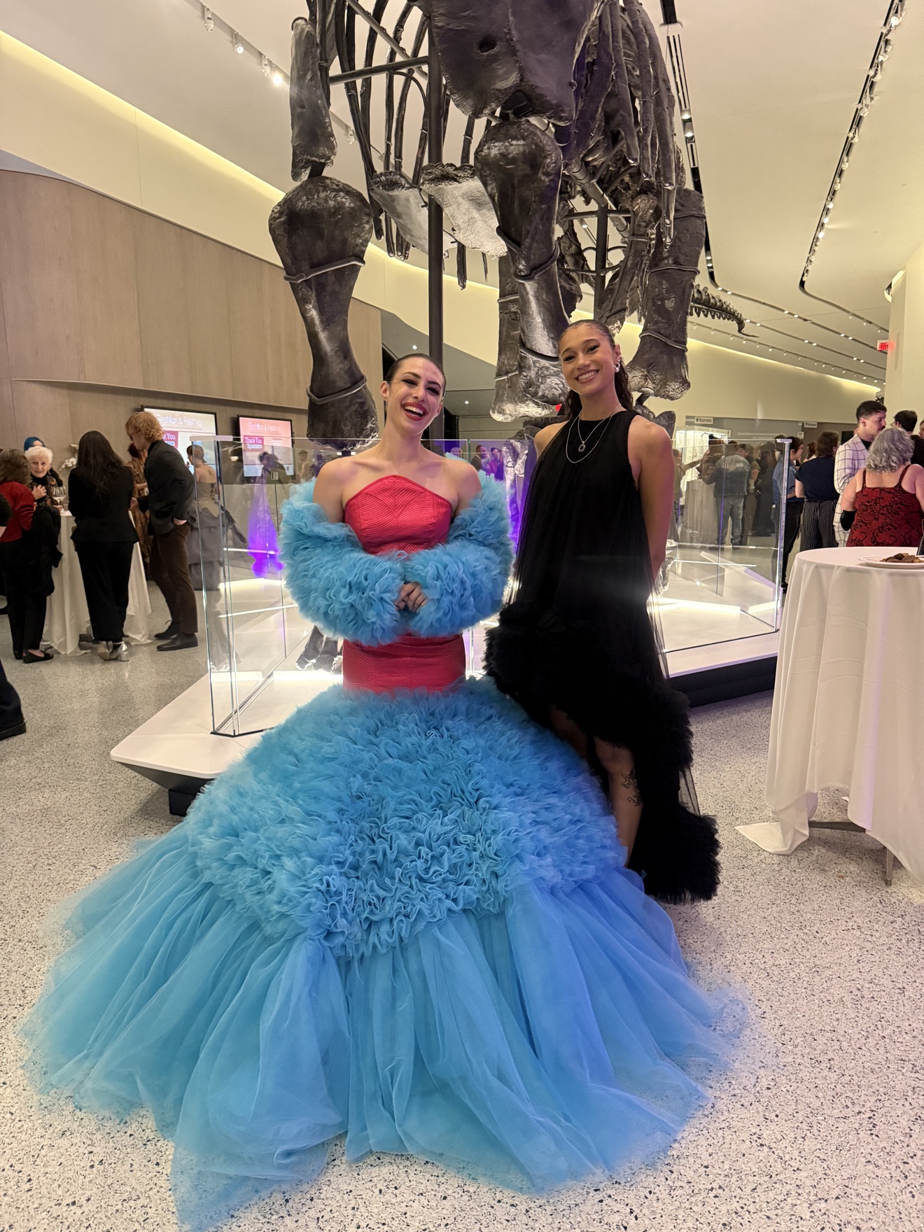 Strapless gown with a pink bodice and a full ruffled blue skirt