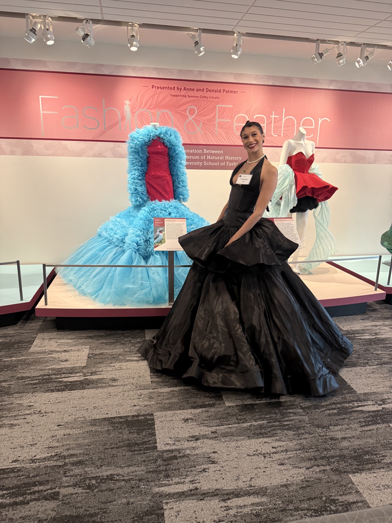Portrait of Freedom LaBay Lee in a black gown at a fashion exhibition